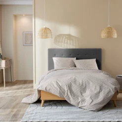 Lit avec sommier et tête de lit capitonnée en velours